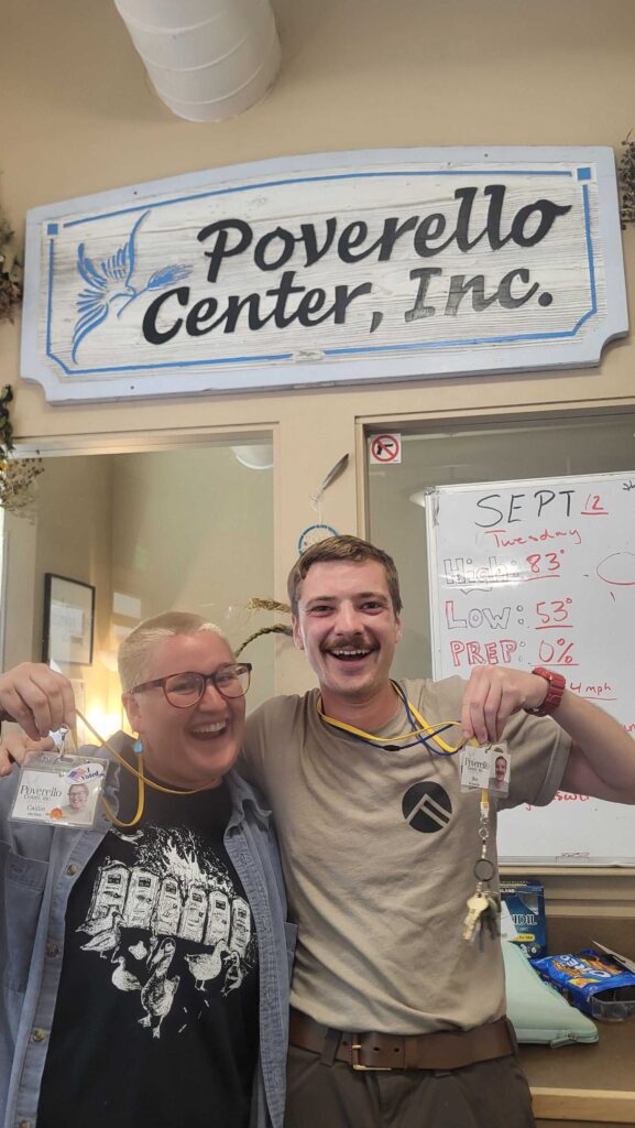 Two staff members, Ben and Caitlin, at our front desk.